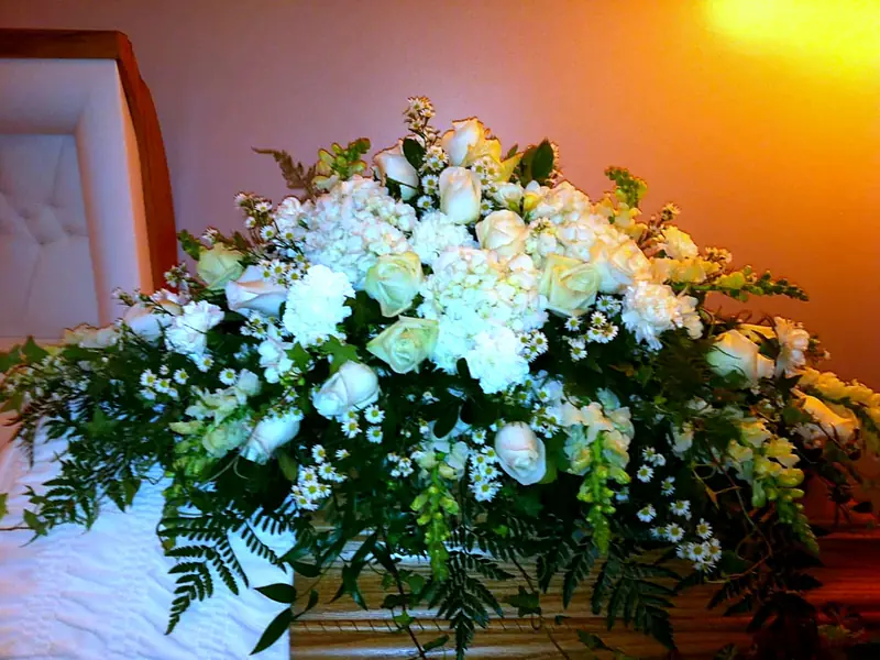 White rose and hydrangea casket spray made by Bramble Bush for a Vernon funeral service