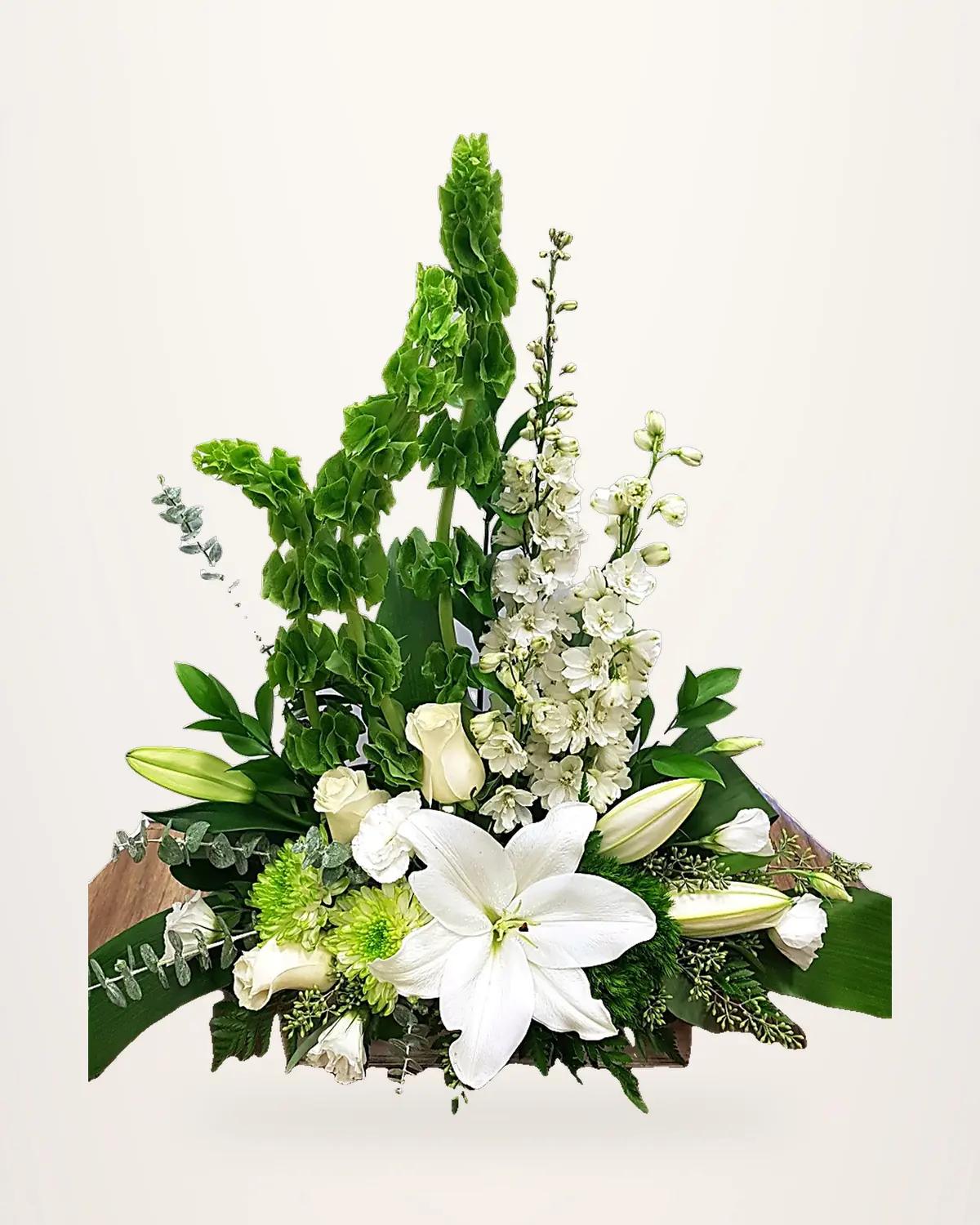 Tall white lily arrangement with bells of Ireland